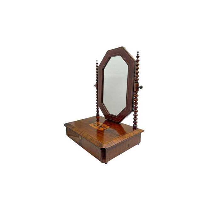 Antique walnut dressing table mirror from the late Victorian period, circa 1900. The octagonal mirror tilts and is...