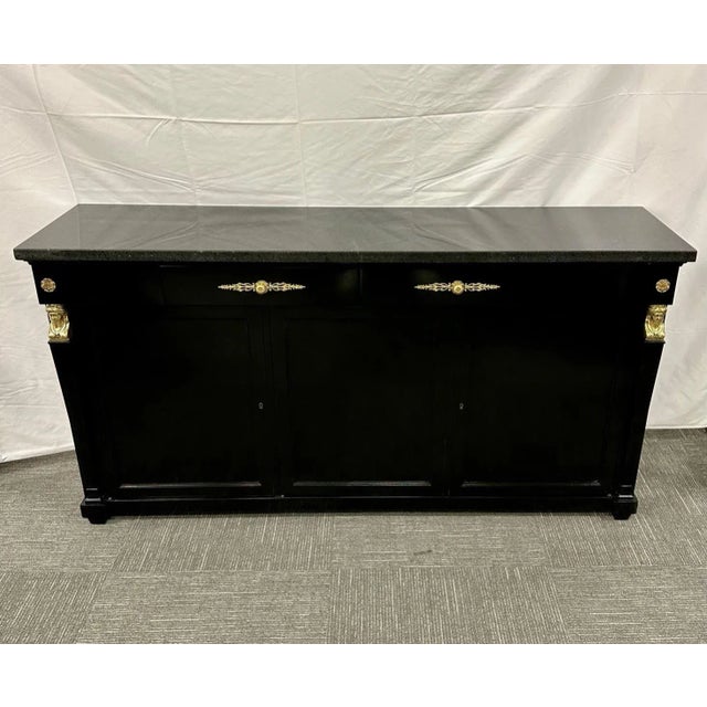 Hollywood Regency Sideboard / Credenza / Cabinet, Bronze Mounted, Empire Style A black lacquered sideboard having two pull...