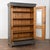 Early 20th-century Hungarian gray painted display cabinet crafted in pine. The exterior features a newer layered steel...