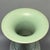 This elegant Gu-shaped vase is crafted in classic Chinese Longquan celadon style. It features a wide flared mouth,...