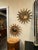 This product is a stunning pair of Italian giltwood sunburst mirrors, perfect for adding a touch of elegance to any home...