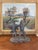Playful and sculptural, this vintage candelabra features two anthropomorphic frogs captured mid-dance, each holding a...