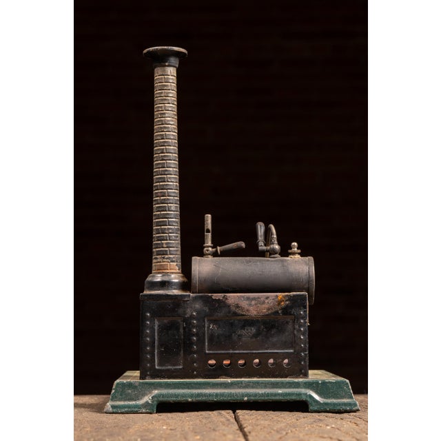 Early 20th-century tabletop live steam engine by Gebrüder Bing of Nuremberg, Germany, featuring a horizontal boiler...