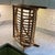 Sculptural MCM rattan magazine rack arched handle, woven side panels. Modern, boho, coastal styles. Lightweight and sturdy.
