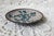 A small turquoise and white floral cloisonne dish. Perfect to hold rings or used as a spoon rest. There are some chips on...