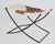 A handsome accent stool featuring a brown-and-white hair-on-hide sling seat over a sculptural black metal X-base. The...