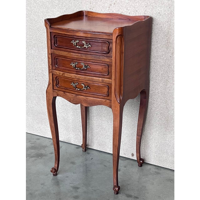 About the Item A pair of Antique French Louis XV Marquetry top nightstands. Subtle contours and scroll shapes are evident...