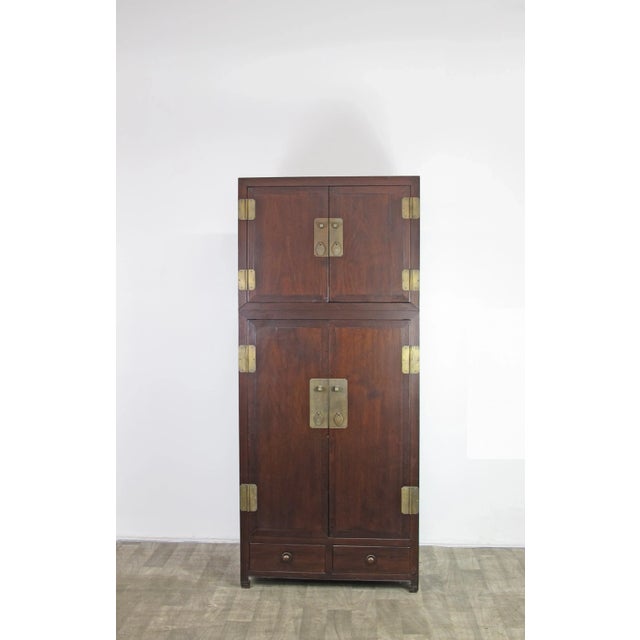 Traditionally this classic Chinese storage cabinet was always used as a pair and placed symmetrically in a living room to...