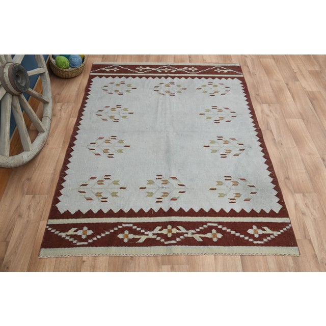 Vintage Turkish Hand-Knotted vintage rug is a semi-antique vintage area rug. The '70s Eastern region of Turkey's unique...