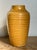 Infuse your decor with a burst of warm sunshine using this charming vintage ceramic vase. Finished in a rich, glossy...