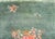A beautiful early 20th century Chinese Art Deco rug with mint green field with a basket filled with multi-colored peonies...