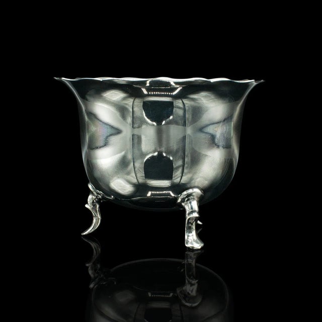 This is a small antique serving bowl. An English, silver plated mustard or condiment pot, by Mappin & Webb, dating to the...