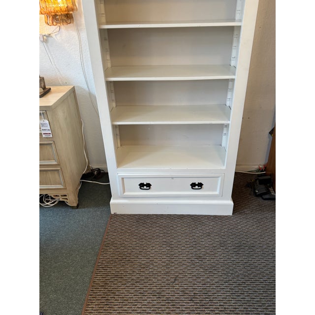 Design Plus Gallery presents a White Bookshelf with Single Drawer. The tall shelf offers you five shelves that can be...