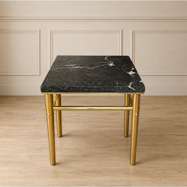 Add timeless sophistication to your space with this vintage side table, featuring a polished black marble top accented by...