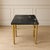 Add timeless sophistication to your space with this vintage side table, featuring a polished black marble top accented by...