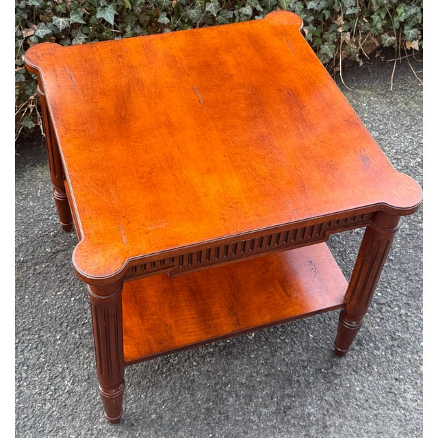 Gorgeous solid cherry French regency end table. Table features regency style reeded legs, reeded apron, tiered...