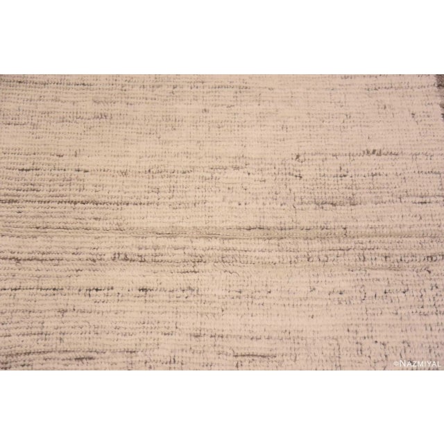 A Decorative Abstract Solid Ivory Cream Background Modern Minimalist Hallway Runner Rug, Country of Origin: Central Asia,...