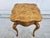 A gorgeous square and somewhat diminutive side table with a burlwood top by Baker Furniture. A versatile piece at 14.5...