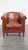 Offered is this neat, in good condition cowhide leather club chair in a beautiful cognac color. With its timeless design...