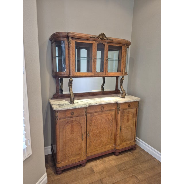 Offering this gorgeous French Louis XVI Style Burled bird's eye maple buffet/sideboard, with marble and mirror. The keys...