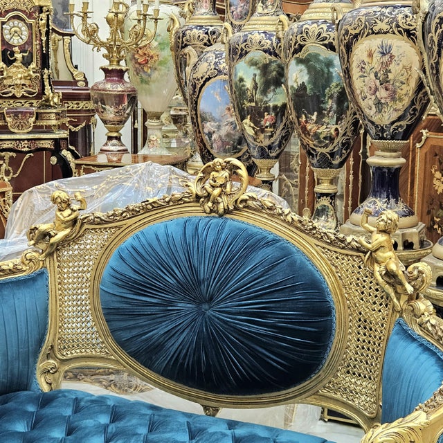 This exquisite French style sofa is a true masterpiece, intricately hand-carved from solid wood and finished in luxurious...