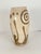 This off-white/cream crackle stoneware /earthenware vase with carved spirals is from Freehand, a long time highly regarded...