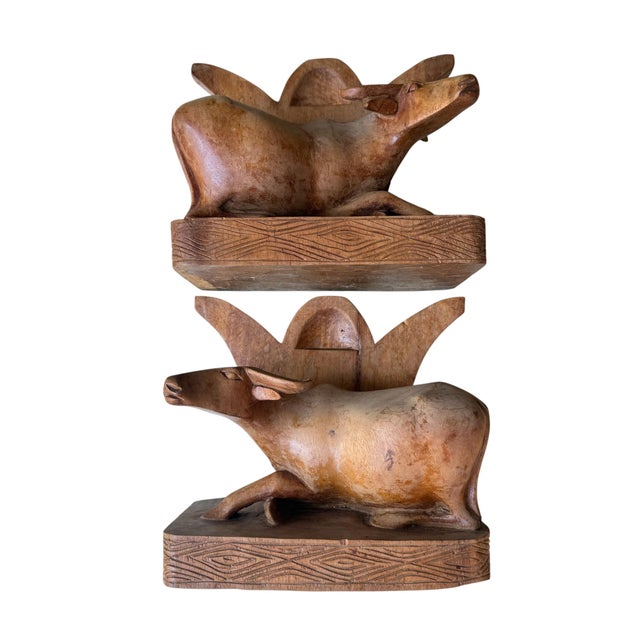 Pair of Vintage Carved Wooden Water Buffalo Bookends Hand-carved wooden bookends featuring a water buffalo, rich with...