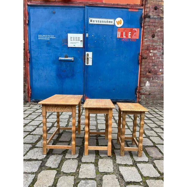 These three nesting tables, crafted from solid oak, were designed by Carl Eriksen for Cemo Möbel in Odense and date back...