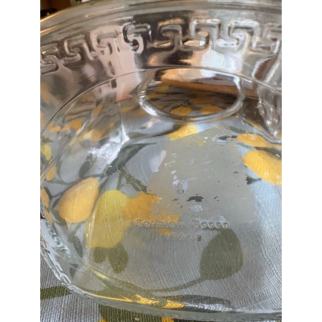 Sunlight spills across a lemon patterned table cloth catching the clean edges of the Bormioli Rocco glass pitcher. Ready...