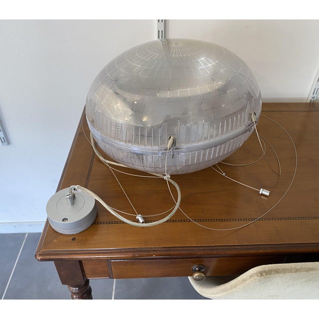 The price is for one pendant light; four pendant lights are available for sale. This polycarbonate pendant light has a...