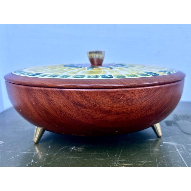 Aren’t you tired of the big box choices for home decor? The brightly colored faux mosaic tile top of this lidded tin...