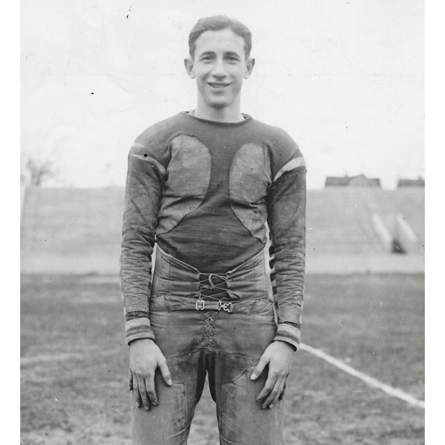 1922 black and white photo of a football player. Marked on the back "Toledo Scott" and "Grin Halfback" so it is probably a...