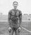1922 black and white photo of a football player. Marked on the back "Toledo Scott" and "Grin Halfback" so it is probably a...