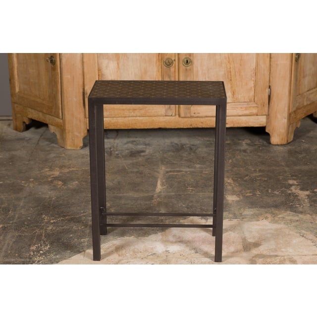 A narrow side table made of a Louis Vuitton leather top, mounted on a custom metal base. Step into a world of refined...
