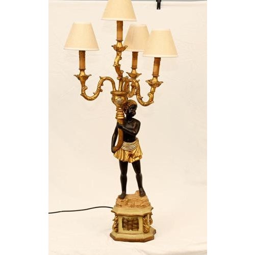 Distinctive pair of Italian Florentine blackamoor candelabras/lamps. The pair is both intricately hand-painted. Good size...