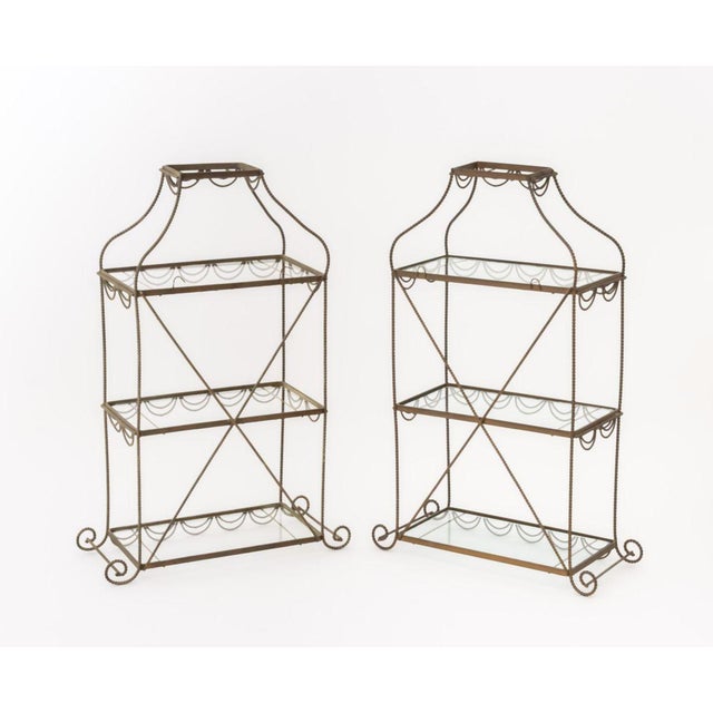 Pair of Regency Style Gilt Metal and Glass Three-Tier Etageres. 24" H x 12.5" W x 6.5" D. Provenance: From a Central Park...