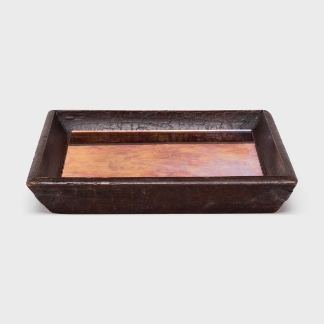 Simple lines, a modest form, and a layer of hand-brushed lacquer give this petite Qing-dynasty tray a provincial charm...