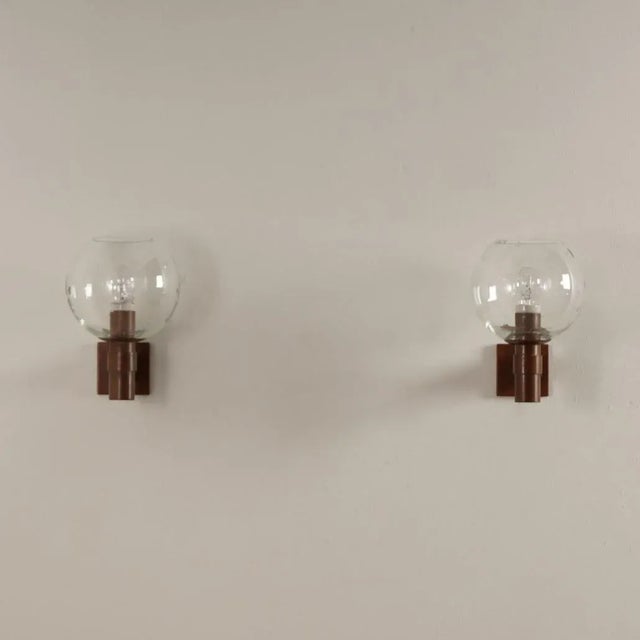Pair of beautiful solid brass wall lights with a glass globe with drops (in the glass) from the 60s. The brass crew bulb...