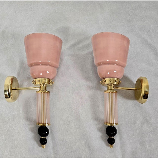 Pair of mid-century modern Murano glass wall sconces, Italy circa 1990s. The pair of Italian sconces is made of powder...