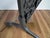 A vintage American wrought iron free standing fire screen with a decorative acorn and leaf scrolled centered panel, wire...