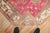 A rare armenian Rug depicting 2 Komodo Dragons on a pink fuchsia field Measures: 5'2'' x 9'4''.
