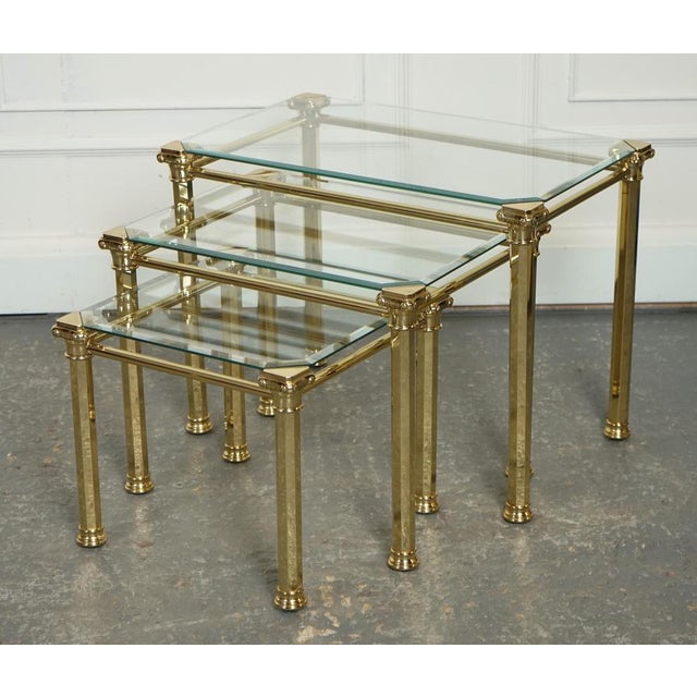 Set of 1970s Hollywood Regency Brass & Glass Nest of Tables Including the Side Table. A luxurious and glamorous piece of...