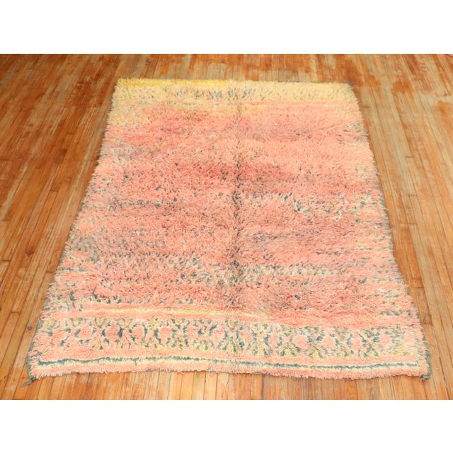 A 3rd quarter of the century One of a kind Moroccan Rug in bright pink and yellow. Bohemian at its finest! Size: 6'6'' x...