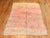 A 3rd quarter of the century One of a kind Moroccan Rug in bright pink and yellow. Bohemian at its finest! Size: 6'6'' x...
