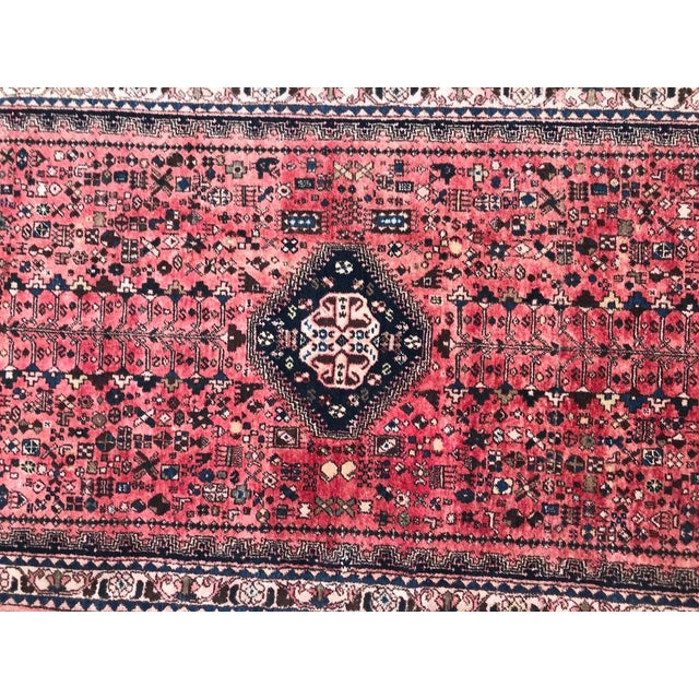 Nice late 20th century runner with beautiful geometrical and tribal design and red partly faded field color with blue,...