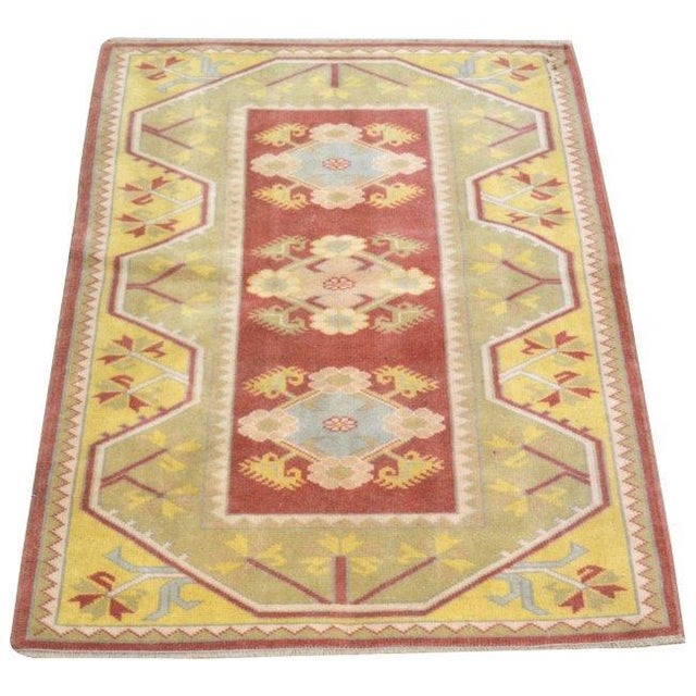 Vintage Turkish Anatolian hand knotted wool rug with natural colors.