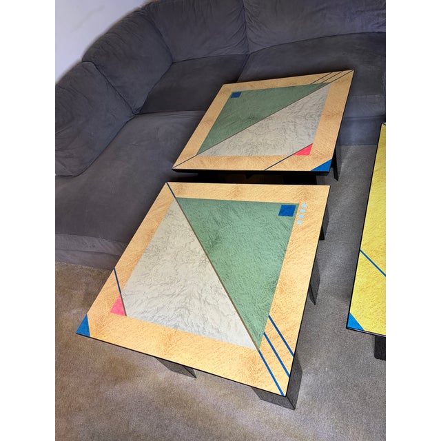 Overview Presenting an exceptionally rare and striking set of three vintage Italian Postmodern tables by the renowned...
