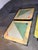 Overview Presenting an exceptionally rare and striking set of three vintage Italian Postmodern tables by the renowned...