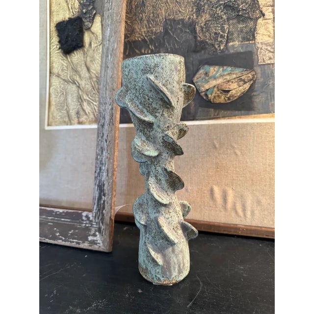 Vintage ceramic vase in turquoise with a gorgeous patina. This ceramic vessel can act as a sculpture or a decorative...