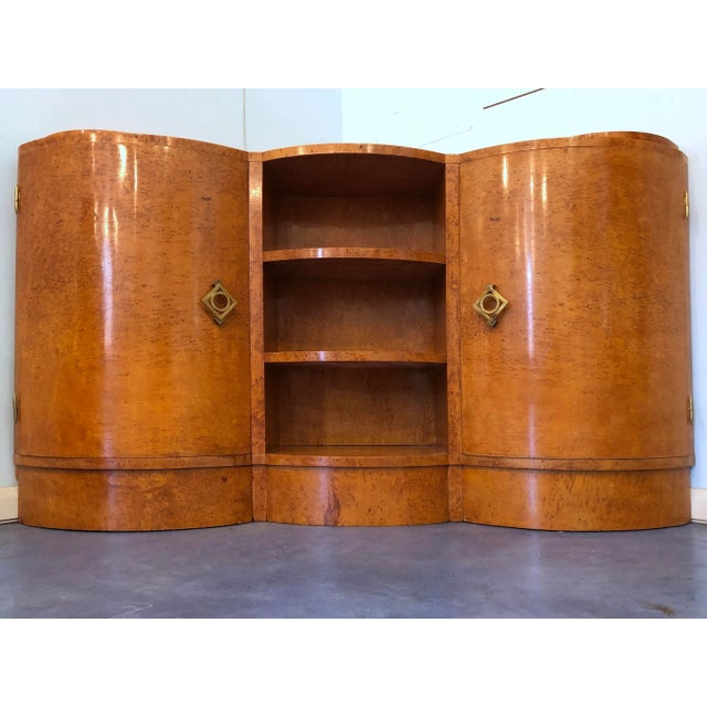 Very rare French Art Deco corner cupboard in wax-finished maple wood, truly unique movement of lines on the front.